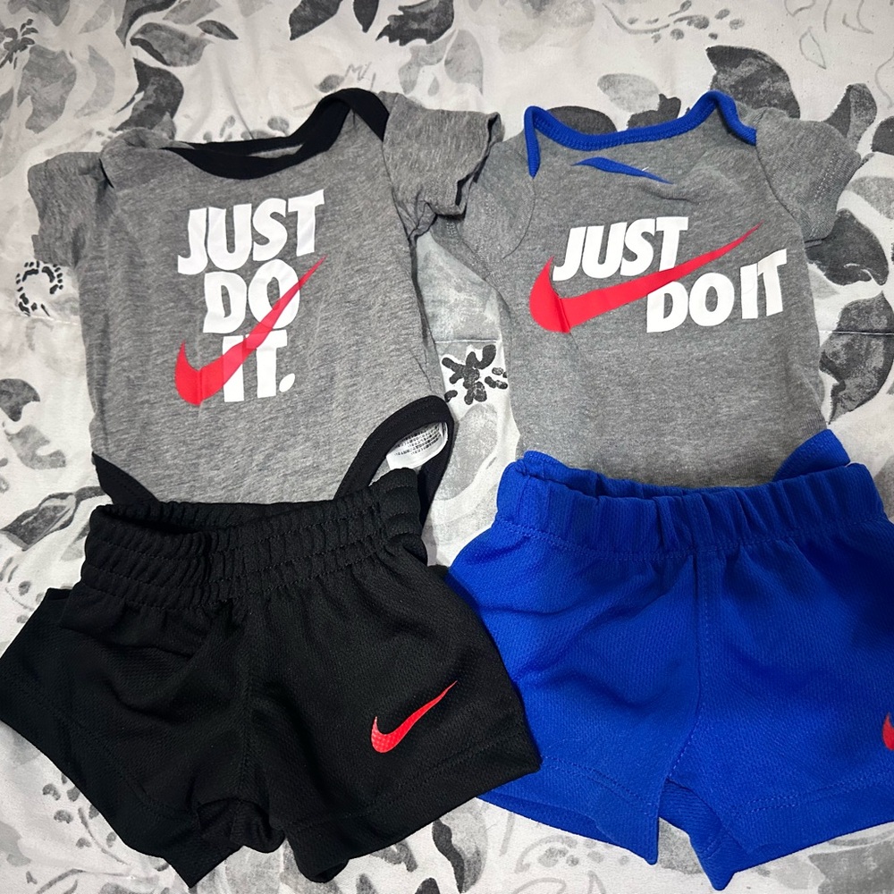 2 newborn Nike sets